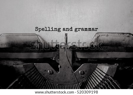 Spelling and grammar typed words on a Vintage Typewriter. Royalty-Free Stock Photo #520309198