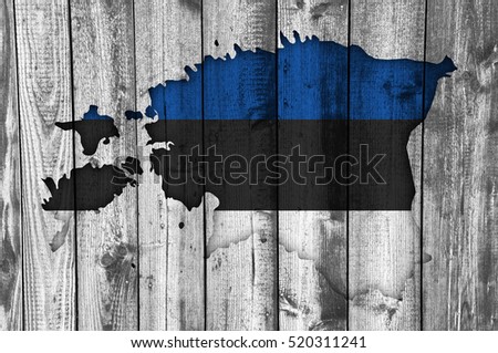 Map and flag of Estonia on weathered wood