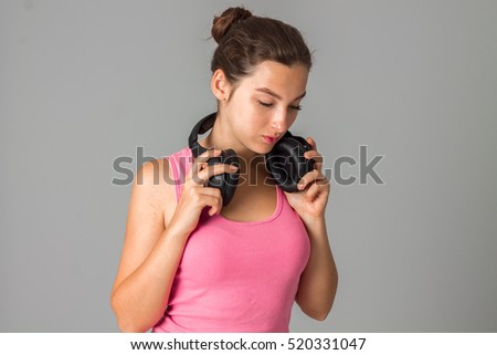 girl with headphones in studio