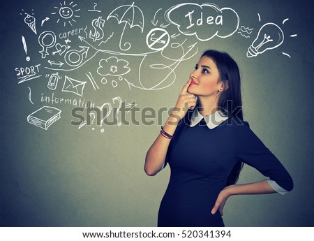 Portrait happy young woman thinking dreaming has many ideas looking up isolated grey wall background. Positive human face expression emotion feeling life perception. Decision making process concept