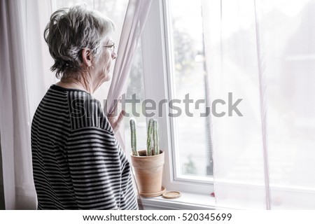 A worried senior woman at home felling very bad Royalty-Free Stock Photo #520345699