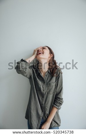 Handsome woman in shirt. so funny. isolated gray background