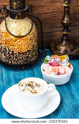 Eastern dessert Turkish delight and coffee with cream. Studio Photo