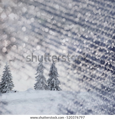 abstract Christmas background with holiday lights and copy space - magic blue bokeh glitter with blinking stars and falling snowflakes