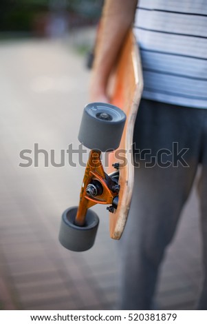 a man riding a skateboard in the park in the summer