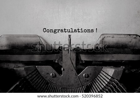 Congratulations ! typed words on a Vintage Typewriter.