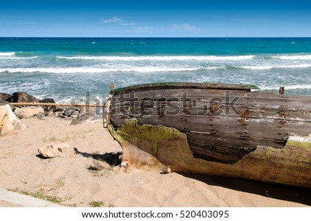 old boat on a sunny beach