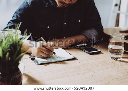 Image of businessman working at work table,home office desk background, Desk musicians,checklist planning investigate enthusiastic concept. Royalty-Free Stock Photo #520432087