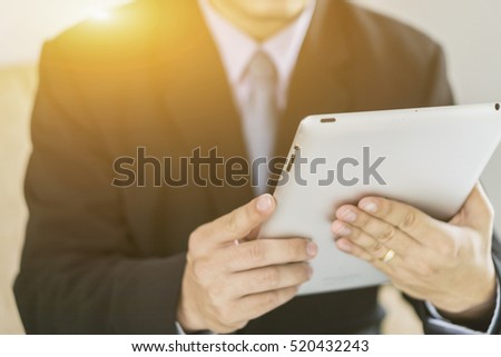 Asian Business man use tablet pc,selective focus,vintage color
