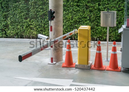 Security system for building access - barrier gate stop with toll booth, traffic cones and cctv