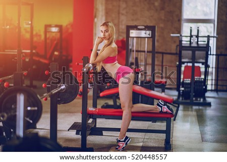 sports girl in the gym performing various exercises. leading a healthy lifestyle