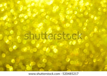 A lights gold yellow bokeh  defocused.  Abstract Christmas  background with bokeh.