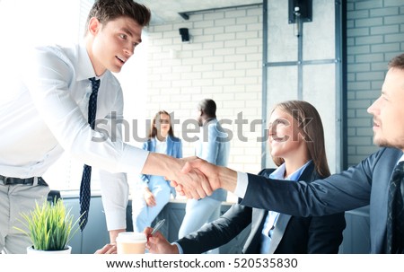 Job applicant having interview. Handshake while job interviewing Royalty-Free Stock Photo #520535830
