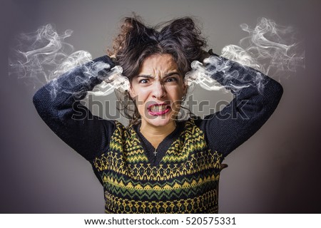 Furious and frustrated caucasian woman steaming with rage Royalty-Free Stock Photo #520575331