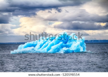 Arctic iceberg at area Novaya Zemlya, Kara sea (deep sea). Blue icebergs is storage of fresh water and aesthetic object - This is a meeting with a miracle of nature