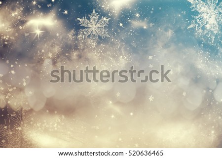 Magic blue holiday abstract glitter background with blinking stars and falling snowflakes. Blurred bokeh of Christmas lights. Royalty-Free Stock Photo #520636465