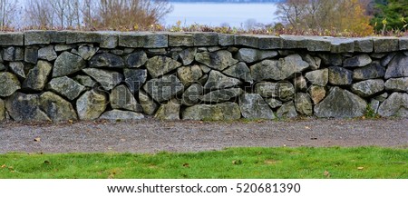Stone Wall:  This stone wall is in Discovery Park - Seattle, Washington. Royalty-Free Stock Photo #520681390