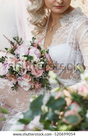 the bride holds bouquet