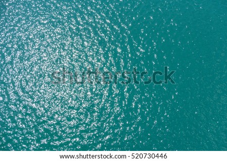 sea water smooth surface, ocean reflection sun, view above water 40 meter Royalty-Free Stock Photo #520730446