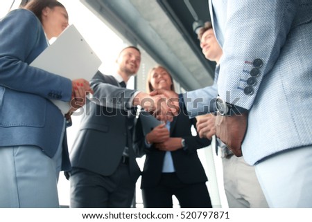 Business people shaking hands, finishing up a meeting  Royalty-Free Stock Photo #520797871