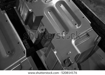 Car parts Produced by Sheet Metal Stamping Tool Die. Black-and-white photo.