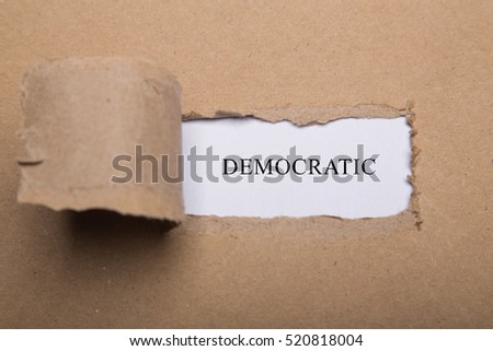Torn paper box with word DEMOCRATIC on white background.