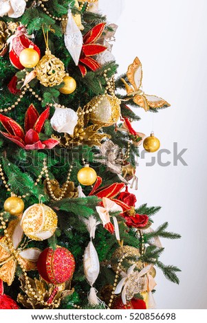 Beautiful Christmas living room with decorated Christmas tree, gifts and fireplace. The idea for postcards