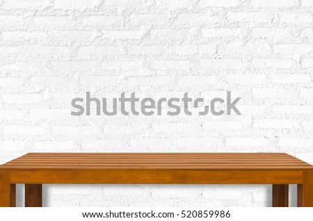 Empty wooden table and white wall interior background for product display montage,can be used for montage or display your products.
