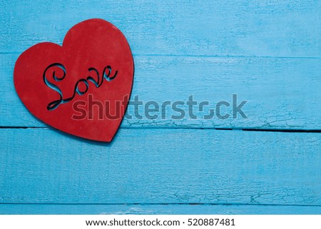 Red heart on turquoise background love
