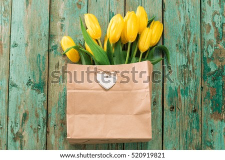 beautiful yellow tulips on wooden background, father, mother, women, valentine's day concept