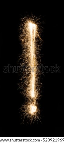 Exclamation point sign. Sparkler firework light alphabet punctuation mark, text symbol on black background. Font pattern.