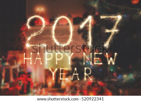 2017 New year font made from sparkler firework on decorated room background. Two thousand seventeen numbers from sparkling burning flames. Illuminated date figures, pattern for calendar