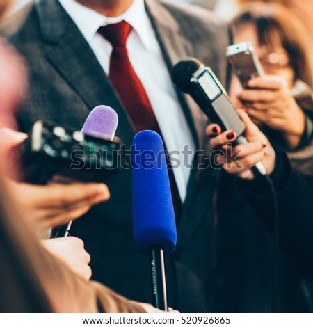 Interviewing businessman on press Royalty-Free Stock Photo #520926865