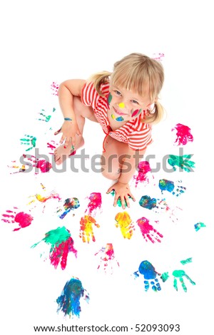 Cute little girl making hand prints. Isolated on white background.