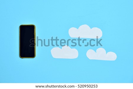 Smartphone and clouds on a blue background
