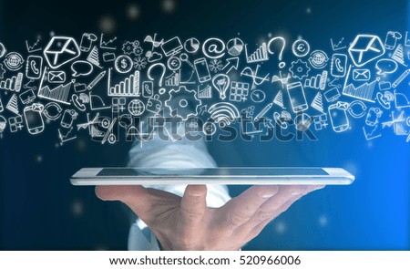 View of a Hand of a man holding tablet with business icons all around