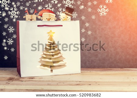 Festive white paper-bag with christmas tree, snowflakes and christmas cartoon papercut style with free copy space for your text