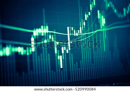 Financial data on a monitor as Finance data concept. Analytics Report Status Information Analysis Chart Graph in digital screen. Business analyzing financial statistics displayed on the tablet screen. Royalty-Free Stock Photo #520990084