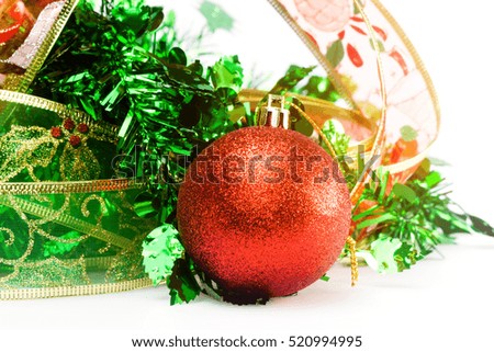 Christmas balls and ribbon in winter setting, Winter holidays concept.