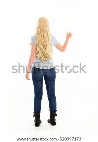 full length portrait of a woman with long blonde hair wearing casual blue shirt and jeans. standing pose. isolated on a white background.
 Royalty-Free Stock Photo #520997173