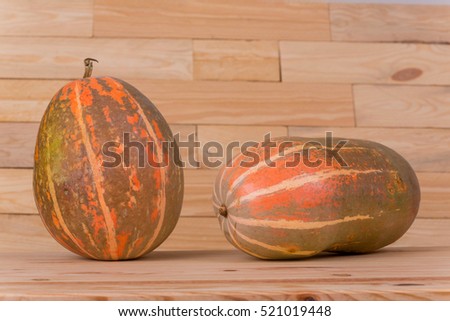 pumpkins on a wooden background, studio picture