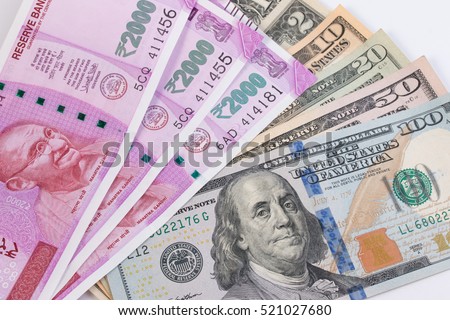 2000 rupee banknote over US dollar banknote. Economy finance trade business concept. Royalty-Free Stock Photo #521027680