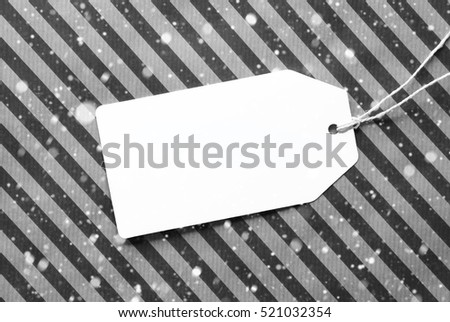 Label On Black Wrapping Paper And Copy Space, Snowflakes