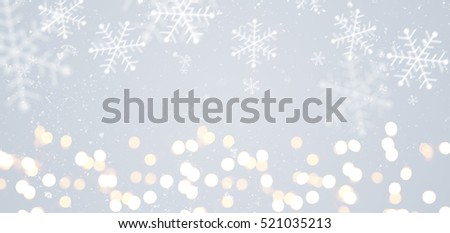 Grey festive Christmas or New Year background with shiny golden baubles