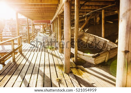 wooden pier rope, moored fishing boat
