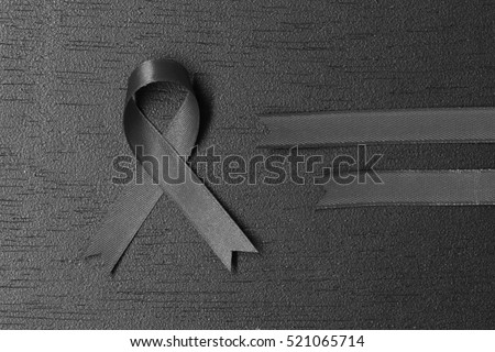 Black ribbon. melanoma awareness. Mourning symbol. copy space for your text.