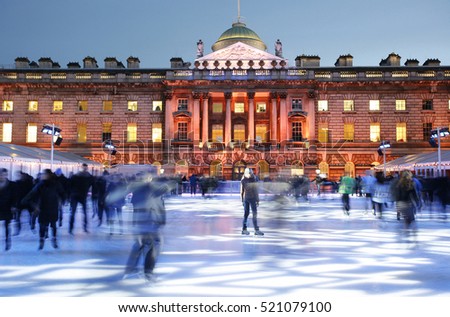 Night View of Somerset House ice rink in Strand, London. Royalty-Free Stock Photo #521079100