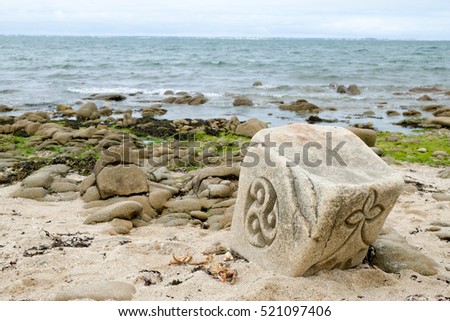 coast in Brittany, rock cliff , ocean, sea  art,sculpture, Sculpture on stone Royalty-Free Stock Photo #521097406