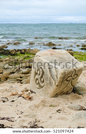 coast in Brittany, rock cliff , ocean, sea  art,sculpture, Sculpture on stone Royalty-Free Stock Photo #521097424