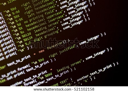 Computer code language on a screen with shallow depth of field. Image taken in an angle.